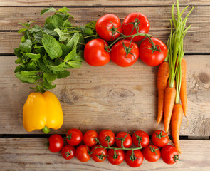 Fresh vegetables on wooden table, top view