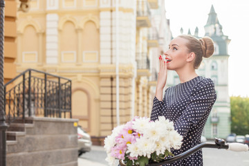 Cheerful young woman is sightseeing in town