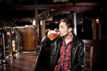 Man drinking beer in pub