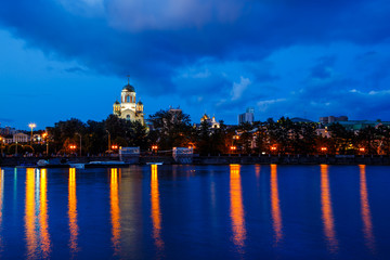 Fototapeta na wymiar Night view of evening city with the river Ural Ekaterinburg