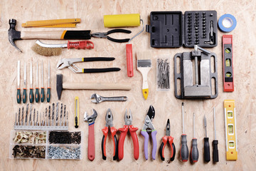 Set of tools on plywood, top view