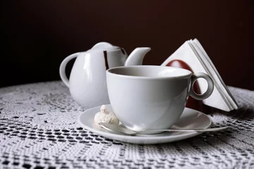 Meubelstickers Hot chocolate in mug, on table, on dark background © Africa Studio