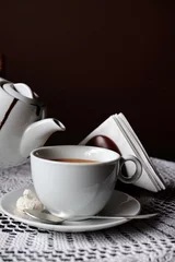 Gordijnen Hot chocolate in mug, on table, on dark background © Africa Studio