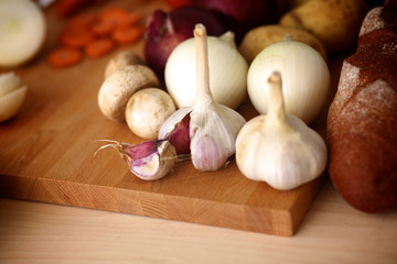 Young woman cutting vegetables in the kitchen