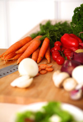 Young woman cutting vegetables in the kitchen