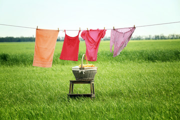 Laundry line with clothes in field