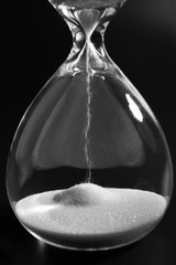 Hourglass on dark background