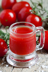 Tomato juice in old-fashioned mug, selective focus