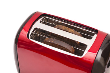 Red toaster and two slices of bread isolated on white