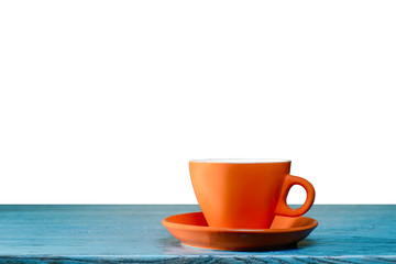 Orange cup on blue table with isolated background