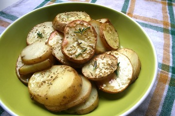 Baked potato on the plate with spices