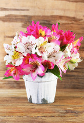 Bouquet of alstroemeria on wooden background