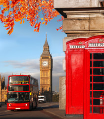 Big Ben with bus and red phone boxes in London, England