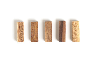 Five wood blocks arange in row.