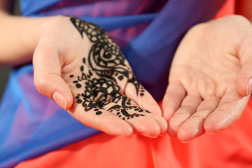 Image of henna on female hand, closeup