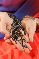 Image of henna on female hand, closeup