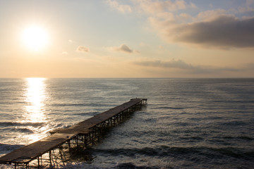 Fototapeta premium Sunrise over sea pier