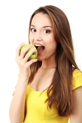 Healthy young woman with green apple isolated on white