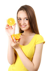 Healthy young woman with sliced orange isolated on white