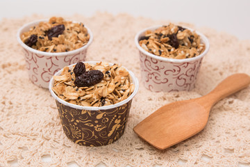 Granola in cupcake cases  on white background