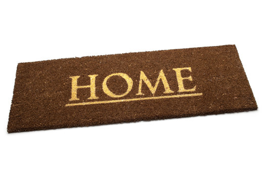 Brown carpet doormat with text Home isolated on white background