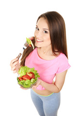 Young slim woman with glass bowl of diet salad isolated on white