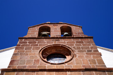 Photography of a brick church bell frontispiece