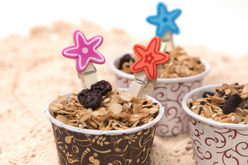 Granola in cupcake cases  on white background
