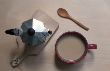 Coffer maker, cup og coffee on the wooden background