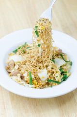 Fire instant noodle on white plate