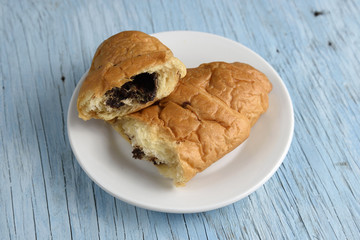 Croissant on old wooden table