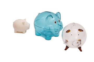 Three Piggy Banks On White Background