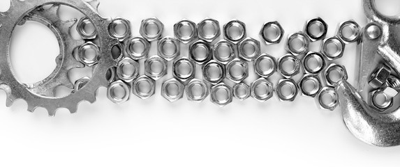 Screw nuts and wrenches frame, isolated on white