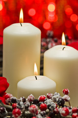 White candles in autumn winter decoration