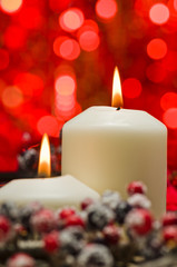 White candles in autumn winter decoration