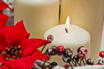 White candles in autumn winter decoration