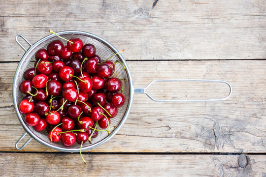 Fresh cherries on the wooden table