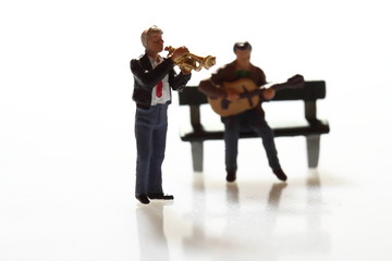 Miniature musicians.
Miniature scale model musicians performing.