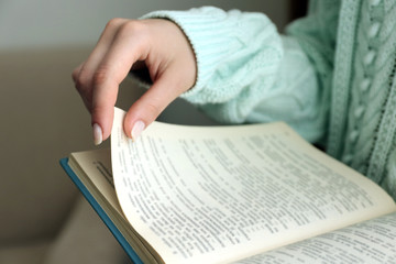 Fototapeta premium Woman reading book in room