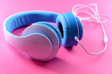 Headphones on pink background