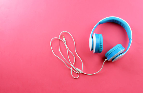 Headphones on pink background