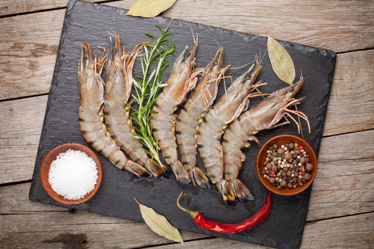 Fresh raw tiger prawns and spices