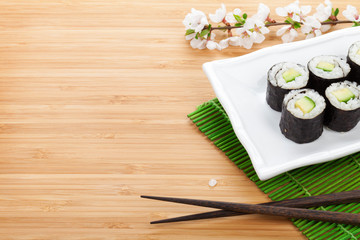 Sushi maki set and sakura branch