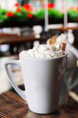 Cup of coffee on table in cafe