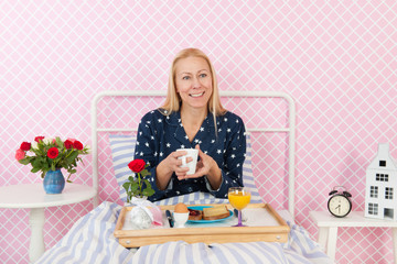 Woman breakfast on bed