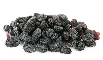 Pile of black dried sultana isolated on white