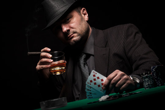 Male gambler playing poker.