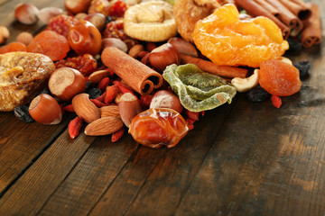 Assortment of dried fruits on wooden table, closeup