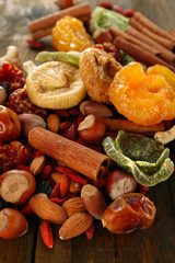 Assortment of dried fruits on wooden table, closeup