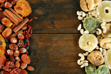 Obraz na płótnie Canvas Assortment of dried fruits on wooden table, closeup